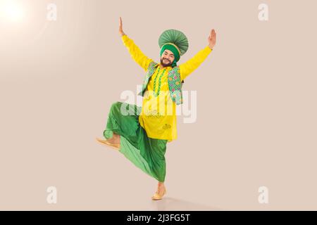 Sikh Man performing bhangra during Baisakhi Celebration Stock Photo