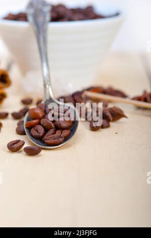 coffe sugar and spice on silver spoon over white wood rustic table Stock Photo