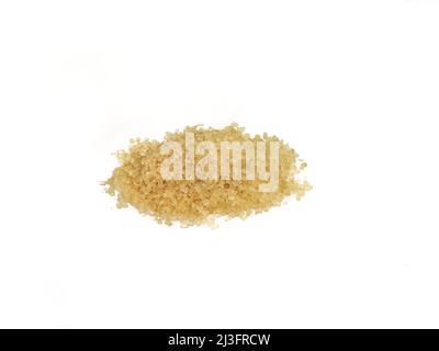 Heap of granulated brown sugar on a white background, macro photo, lots of detail Stock Photo