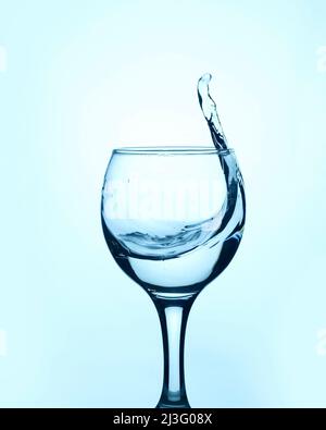 Clear water in a glass, delicious spring transparent with a splash in glass Stock Photo
