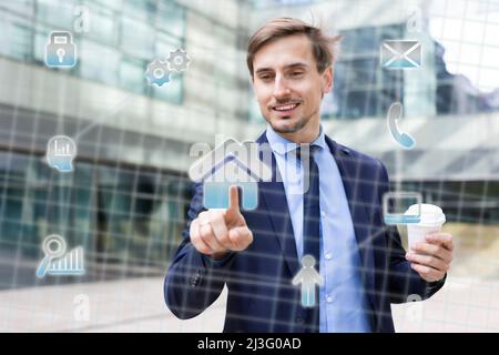 Man pressing icons on virtual touchscreen Stock Photo