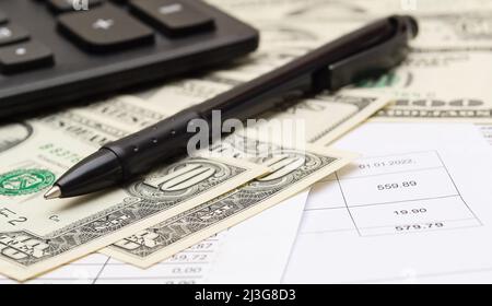 Calculator, money, pen and different bills close-up. Business, household and home budget concept Stock Photo