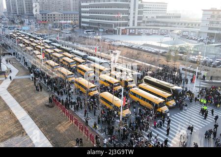(220408) -- CHANGCHUN, April 8, 2022 (Xinhua) -- Buses transporting supportive team members are seen in Meihekou City, northeast China's Jilin Province, April 3, 2022. Some 5,000 supportive staff from Meihekou City who are aiding Changchun, one of the hardest-hit cities in China amid the latest virus resurgence, commute between the two cities every day in order to lessen boarding and lodging burdens on Changchun. The supportive team members, including medics, government officials and police officers, start off early morning and get back in late night, both by taking ferry buses. To ensure the Stock Photo