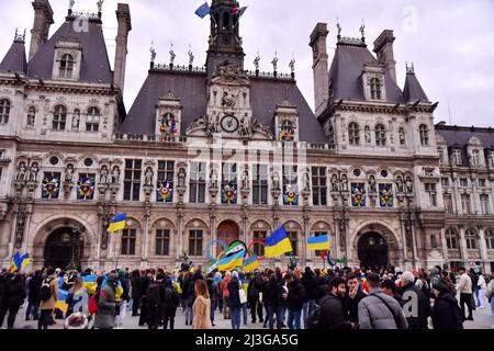 Demonstration gathering against the invasion of Ukraine by Russia, in memory of the victims of the genocide of Boutcha in Ukraine, on the square of the Town Hall. Portrait of a young woman demonstrator holding a sign with the message bucha, with the colors of the Ukrainian flag and a broken heart, during the demonstration. Paris, France on April 6, 2022. Photo by Karim Ait Adjedjou/Avenir Pictures/ABACAPRESS.COM Stock Photo