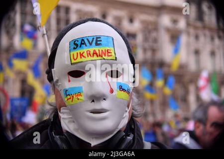 Demonstration gathering against the invasion of Ukraine by Russia, in memory of the victims of the genocide of Boutcha in Ukraine, on the square of the Town Hall. Portrait of a young woman demonstrator holding a sign with the message bucha, with the colors of the Ukrainian flag and a broken heart, during the demonstration. Paris, France on April 6, 2022. Photo by Karim Ait Adjedjou/Avenir Pictures/ABACAPRESS.COM Stock Photo