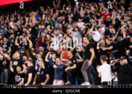 blurred background of supporters at sports event crowd of people in a basketball court Stock Photo