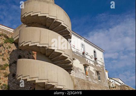 concrete spiral staircase at the exterior of the city walls in Termoli, Molise region, Italy Stock Photo