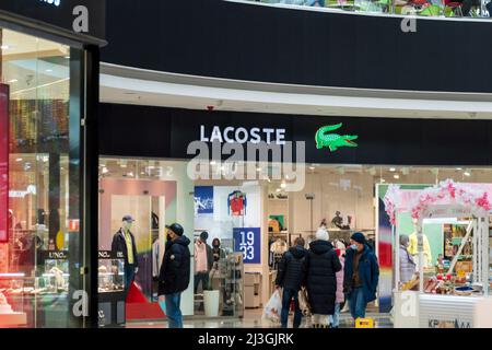 Tyumen, Russia-March 10, 2022: Lacoste French clothing clothes boutique Sale in the shopping center Stock Photo - Alamy