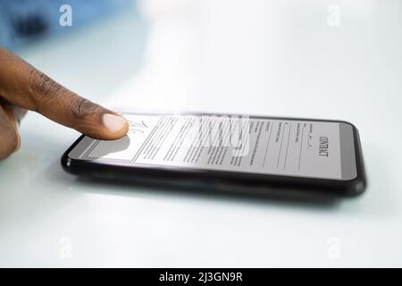 African Man Holding Smartphone Or Mobile Phone Stock Photo