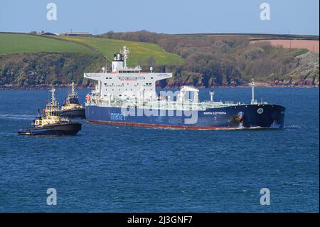 Minerva Eleftheria, an Arfamax tanker operated by Minerva Marine, assisted by Svitzer tugs in Milford Haven - April 2021. Stock Photo