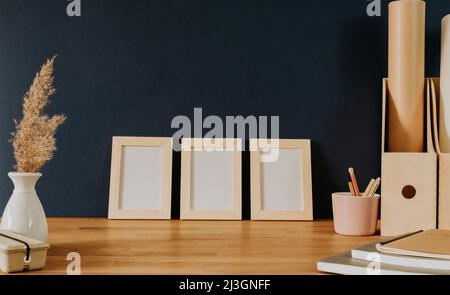 Set of three frames on office desk Stock Photo