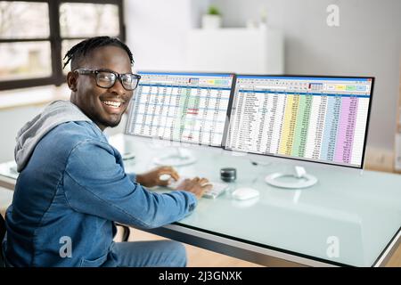 Analyst Employee Working With Spreadsheet On Computer Stock Photo
