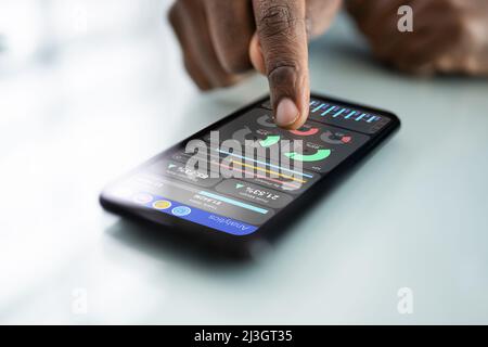 African American Financial Analyst Looking At Data On Data Stock Photo