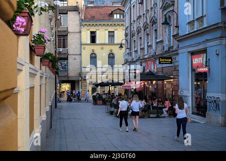 SARAJEVO, BOSNIA AND HERZEGOVINA - JULY 14, 2018: street life of Sarajevo, tables cafe crowded with people in Ferhadija pedestrian street Stock Photo