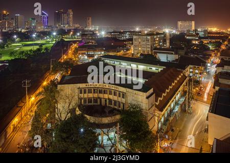 Philippines, Metro Manila, Intramuros, view from Bayleaf Hotel, elevated view of Manila High School, illuminated at night, Manila's first public school, opened in 1906 Stock Photo