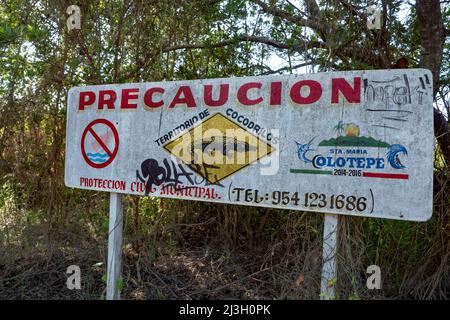 Mexico, State of Oaxaca, Puerto Escondido and its beach, the Punta Zicatela, warning sign, attention to the crocodile, on the banks of the river Colotepec Stock Photo