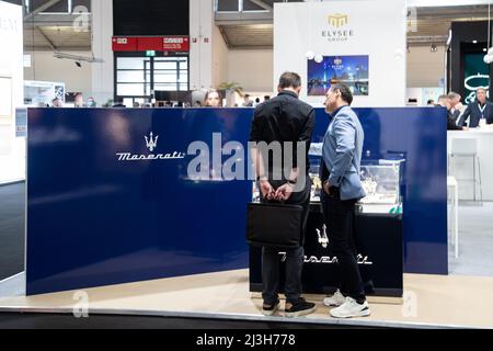 Munich, Germany. 08th Apr, 2022. Maserati on April 8, 2022 at the Inhorgenta trade fair for jewlery and gems in Munich, Germany. Close to 0% percent of the people wear a mask. Prior to the trade fair the organizer Messe Munich was heavily critized, because they refuse to even think about a mandatory mask at the trade fair or an access only for vaccinated or tested people. (Photo by Alexander Pohl/Sipa USA) Credit: Sipa USA/Alamy Live News Stock Photo