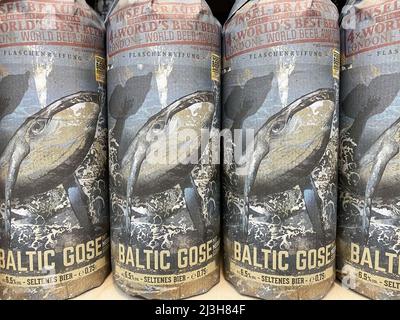 Viersen, Germany - April 5. 2022: Closeup of baltic gose craft beer bottles wrapped in artful paper in shelf from german island brewery Stock Photo