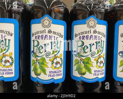 Viersen, Germany - April 5. 2022: Closeup of bottles english Samuel Smith perry sparkling pear cider with vintage artful label in store shelf Stock Photo