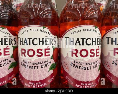 Viersen, Germany - April 5. 2022: Closeup of bottles Thatchers red apple cider in shelf of german supermarket Stock Photo