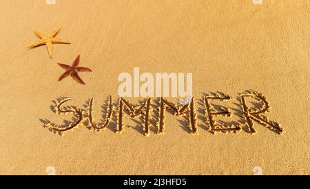 The word summer written in sand Stock Photo