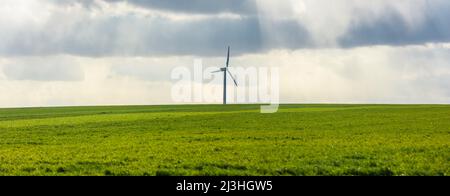 Single wind turbine on a green field Stock Photo