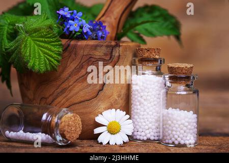 A homeopathy concept Man hands holding a glass bottle of - stock photo  1009821 | Crushpixel