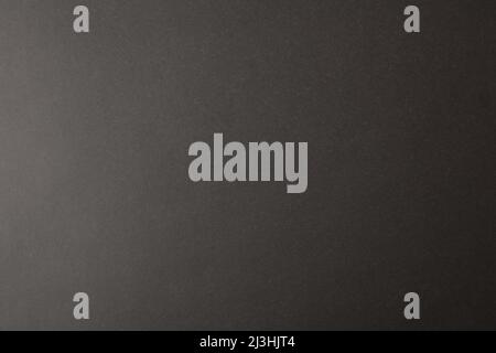 Black cardboard texture gradient background. Top view. Horizontal composition. Stock Photo