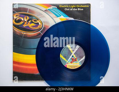 LP cover and blue vinyl of Out of the Blue, the seventh studio album by the Electric Light Orchestra, which was released in 1977 Stock Photo