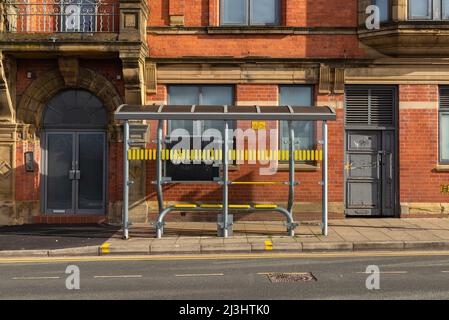 Wigan, England - United Kingdom - March 15th, 2022: Public transportation bus stop in English city. Stock Photo