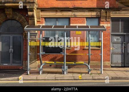 Wigan, England - United Kingdom - March 15th, 2022: Public transportation bus stop in English city. Stock Photo