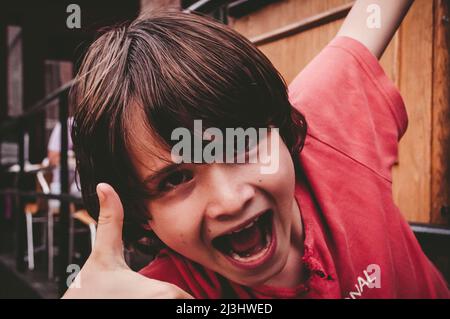 Southside, New York City, NY, USA, 12 years old caucasian teenager boy - with brown hair and in summer outfit somewhere in NYC Stock Photo