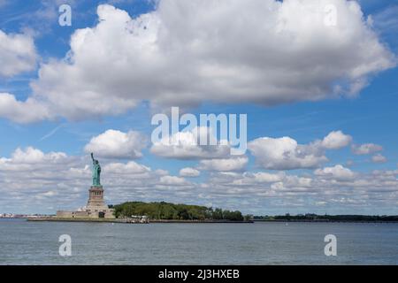 New York City, NY, USA, View of island of Liberty with statue of Liberty seen from the ferry on the Hudson river, symbol of the New York City Stock Photo
