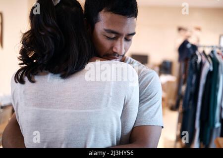 Your support means the world to me. Cropped shot of an affectionate couple embracing each other at home. Stock Photo