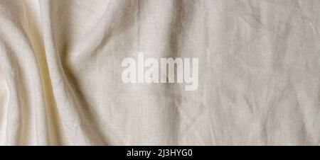 White crumpled linen fabric texture background. Natural linen organic eco textiles canvas background. Top view Stock Photo