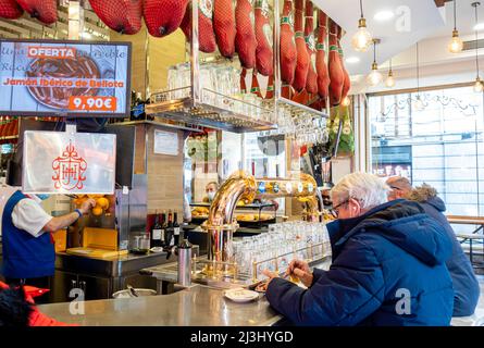 Customers patrons at the bardesk Museo del Jamon, Madrid, Spain Stock Photo