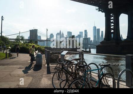 DUMBO, New York City, NY, USA, Manhattan Bridge over East River seen through some trees Stock Photo