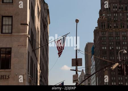 5 AV & W 56 ST, New York City, NY, USA, American Flag on a Building Stock Photo
