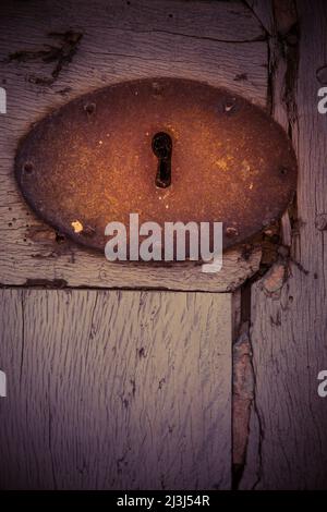 Rusty door fitting on a wooden door in the old town of Sineu, Mallorca, Spain Stock Photo