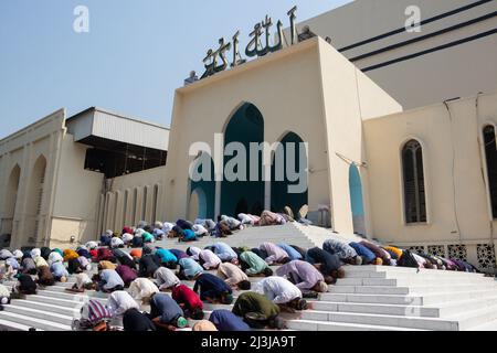 Muslim devotees offer Jummah prayer during the holy month of Ramadan outside of the  Baitul Mukarram National Mosque. On April 8, 2022 in  in Dhaka, B Stock Photo