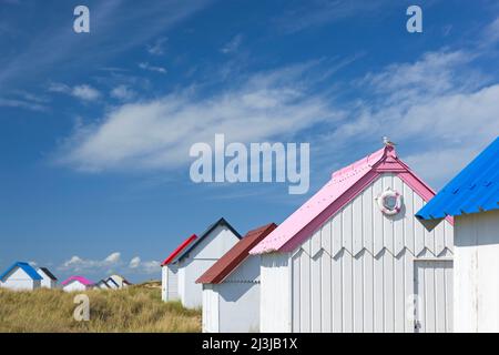 colorful beach cottages in the dunes of Gouville-sur-Mer France, Normandy, Département Manche Stock Photo