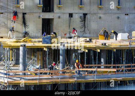 Vienna, high-rise apartment building in construction, construction workers working on ceiling formwork, project 'Danube Flats' in 22. district Donaustadt, Austria Stock Photo