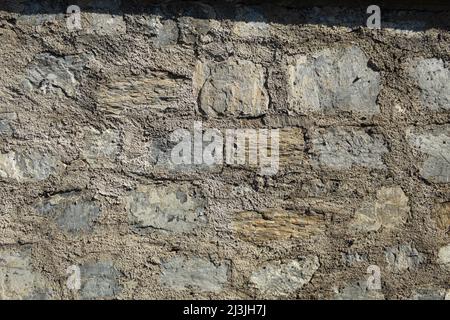 Wall element, large granite stone and concrete. Background texture large granite stone in concrete Stock Photo