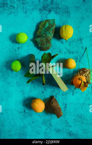 Still Life yellow and green lemons composition in a stone background Stock Photo