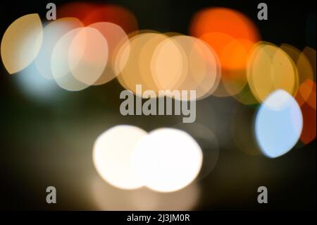Abstract twinkling lights background with bokeh defocused multicolored lights, valentines day celebration, party, round bright bokeh. Stock Photo