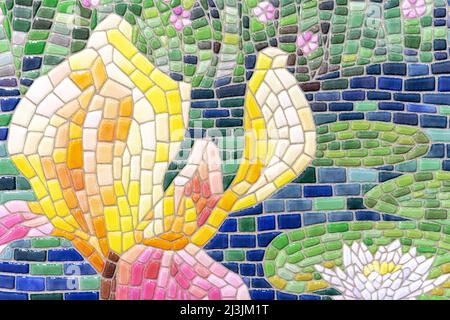 Ceramic mosaic tile laid out in the shape of a flower. Stock Photo