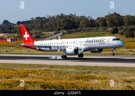 Helvetic Airways Embraer 195 E2 STD (ERJ-190-400STD) (REG: HB-AZJ) touching down runway 31. Stock Photo