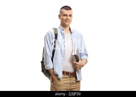 Guy with books and backpack smiling at the camera isolated on white background Stock Photo