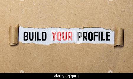 text Build your profile on torn paper, business concept Stock Photo