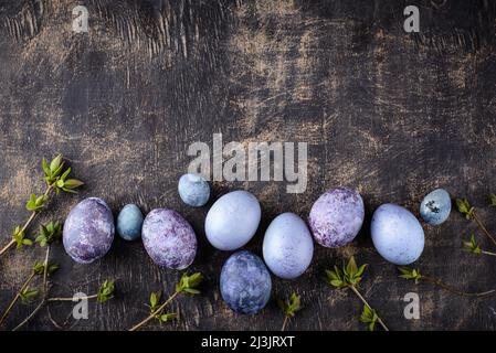 Festive Easter eggs in purple and blue color Stock Photo